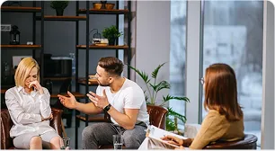 A calm mediation conversation between three people
